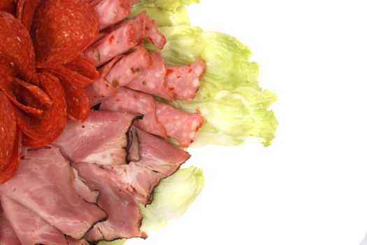 salami and lettuce on the white background