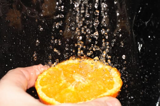 half of orange and the fresh water