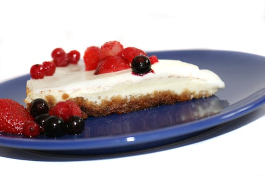 cheesecake with fruits on the white background 