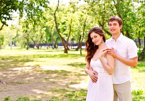 couple hugging in the park, have a good time together