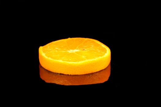 slice of orange on the black background