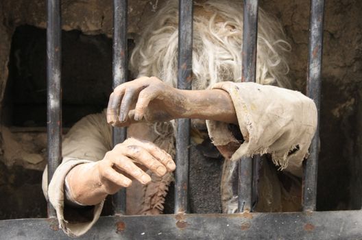 prisoner in the window of the old tower