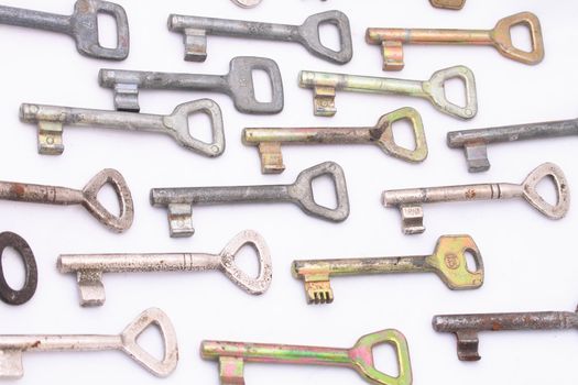 many old keys on the white background