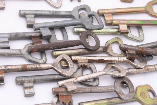 many old keys on the white background