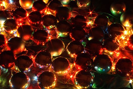 xmas lights and balls on the black background