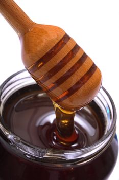 glass of honey on the white background