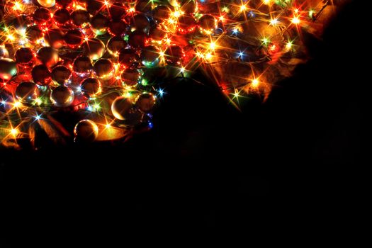 xmas lights and balls on the black background