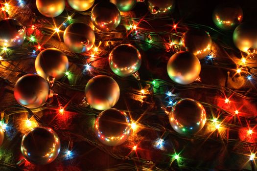 xmas lights and balls on the black background