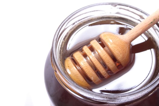 glass of honey on the white background