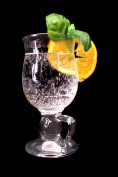 fresh drink with orange on the black background