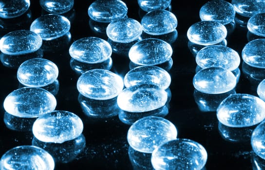 blue water drops on the black background 