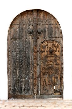 very old door on the white background from the tunisia 