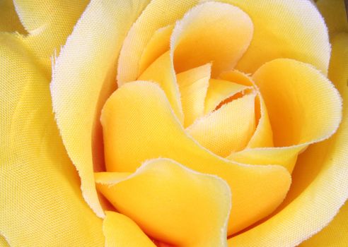 detail of the plastic yellow rose as romantic background