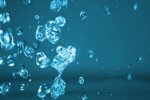 drops of water in the air in the blue color 
