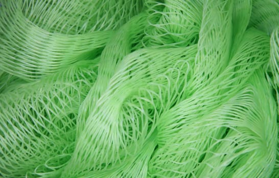 abstract green plastic background (macro photo of texture)