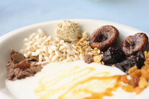 healthly breakfast with honey on the blue background 
