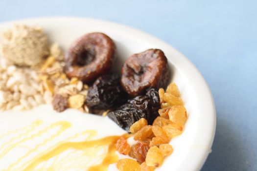 healthly breakfast with honey on the blue background 