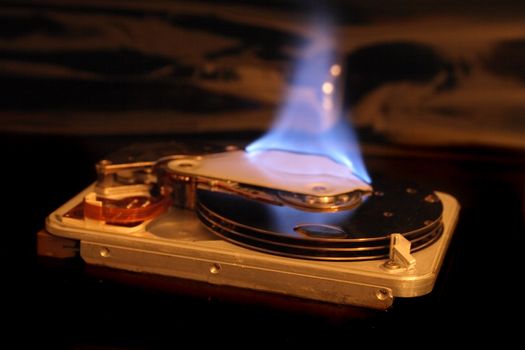 disc in the fire on the black background