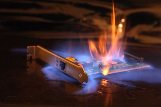 net card in the fire on the black background