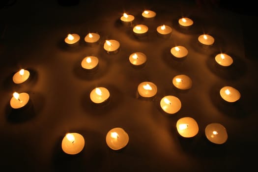 candles in the night on the black background 