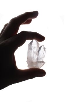 crystal in the hand isolated on the white background