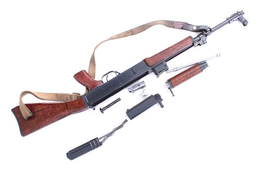 automatic gun and parts of it isolated on the white background 