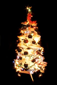 white xmas tree isolated on the black background