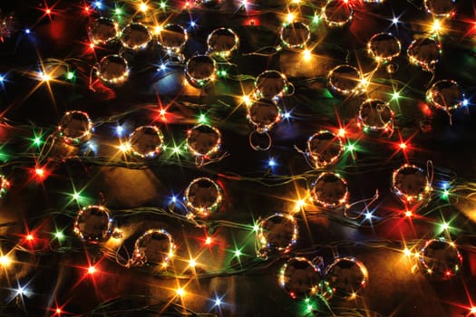 xmas background with color lights on the black background