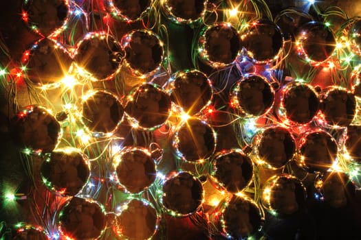 xmas background with color lights on the black background