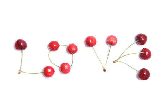 word love from the cherries on the white background