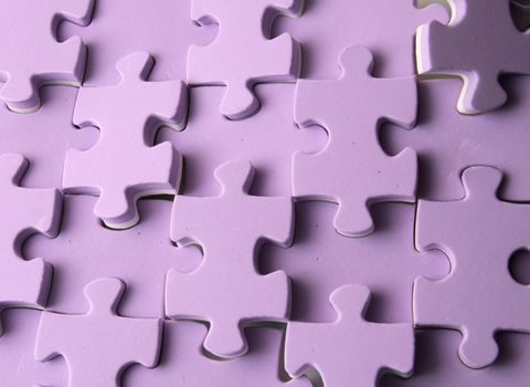 nice violet puzzle background with many pieces