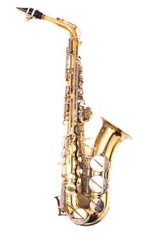 very old saxophone on the white background