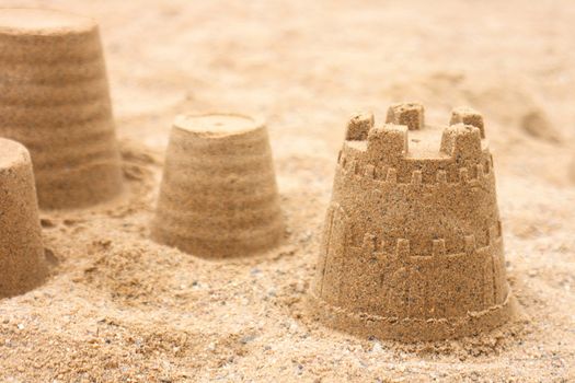 sand object made by childern on the beach 
