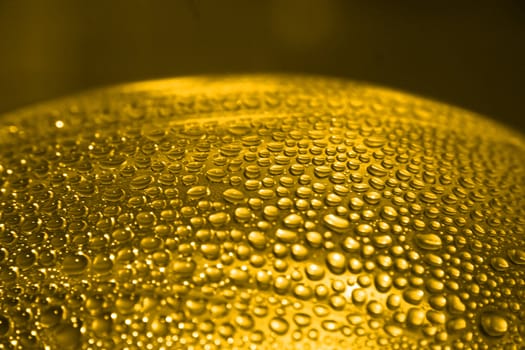 drops of the water on the glass of beer