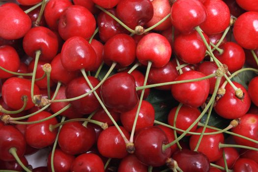 red fresh cherries as natural food background