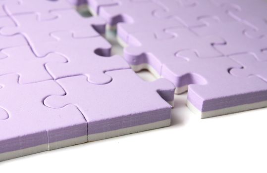 nice violet puzzle on the white background
