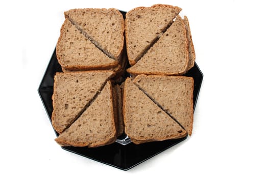 fresh brown bread on the white background 