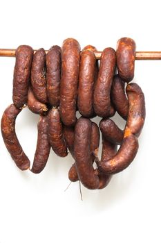 typical czech fresh wursts on the white background
