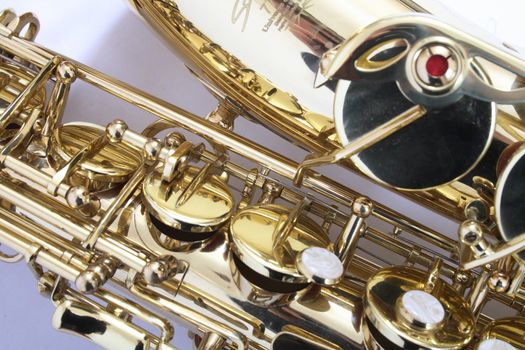 new gold saxophone on the white background