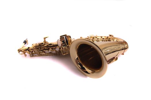 new gold saxophone on the white background