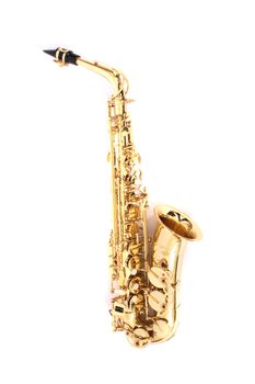 very old saxophone on the white background