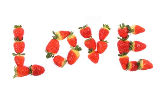 love from the red strawberries on the white background
