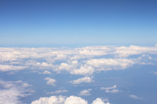 white clouds from the sky onm the blue background