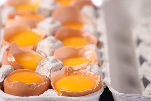 raw yellow eggs in the paper box 