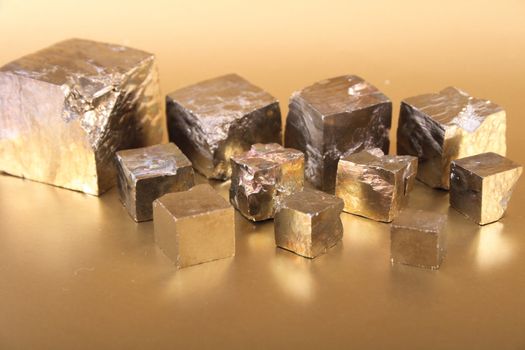 golden cubes on the golden background 