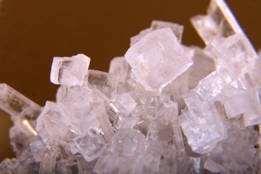 cubes of salt on the golden background 