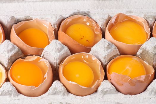 raw yellow eggs in the paper box 