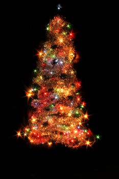 color xmas tree isolated on the black background