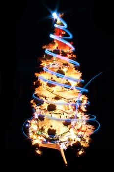 white xmas tree isolated on the black background