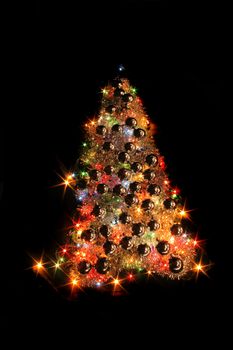 color xmas tree isolated on the black background